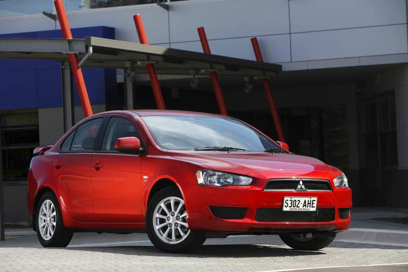 Митсубиси лансер 2010. Мицубиси Лансер 2011 красный. Mitsubishi Lancer 2011. Митсубиси Лансер 10 2011. Мицубиси ланцер 2011.