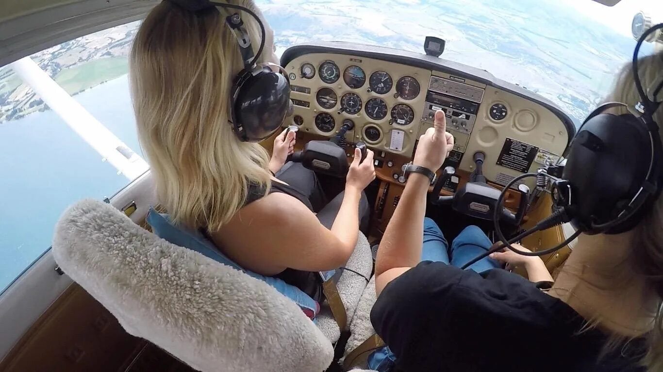 She flies planes. To Fly a plane. Flying Lesson in an Airplane. Fly a plane Spotlight. She Fly a plane.