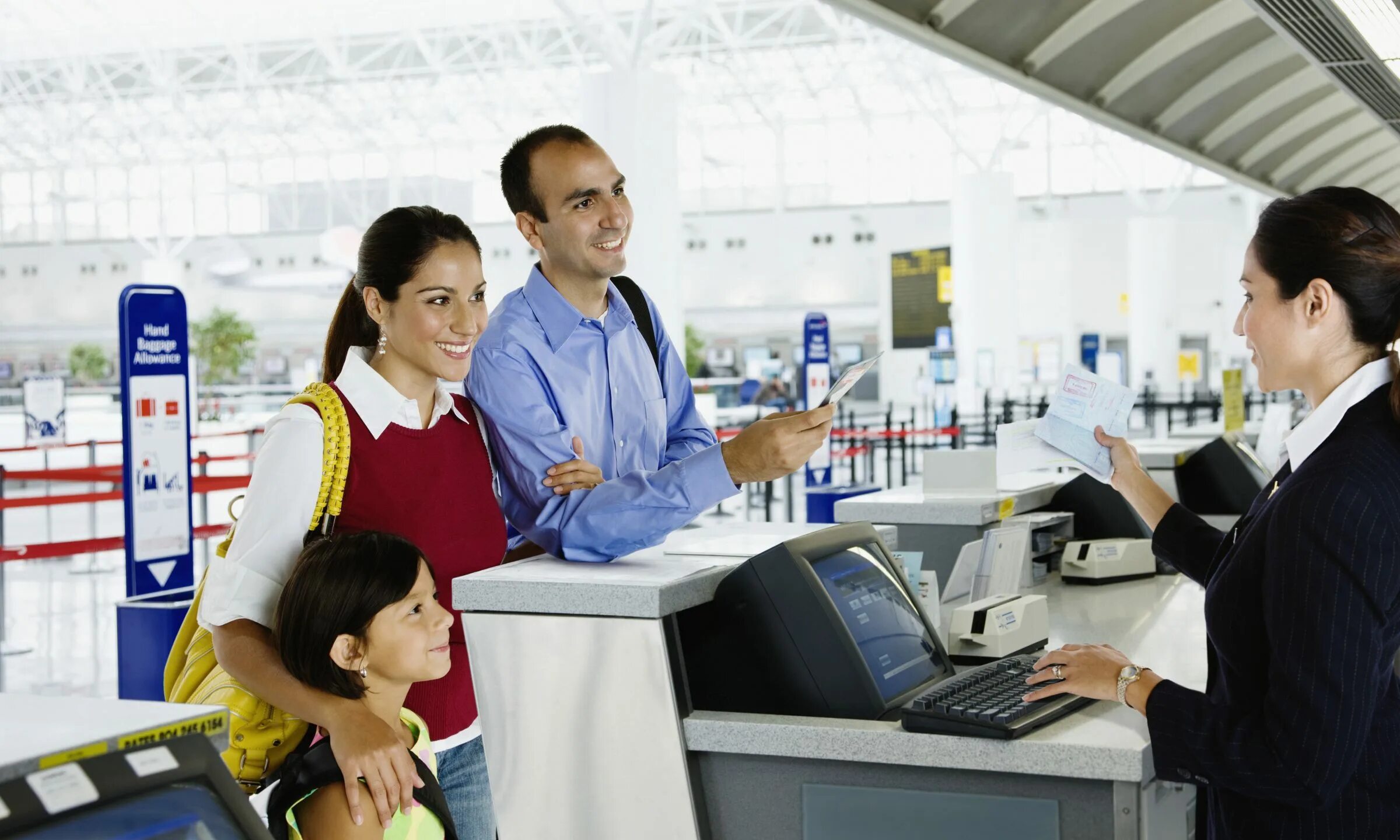 The check in desk assistant asked rob. Китайцы в аэропорту. check in at the airport. checking in at the airport. customer at the airport.