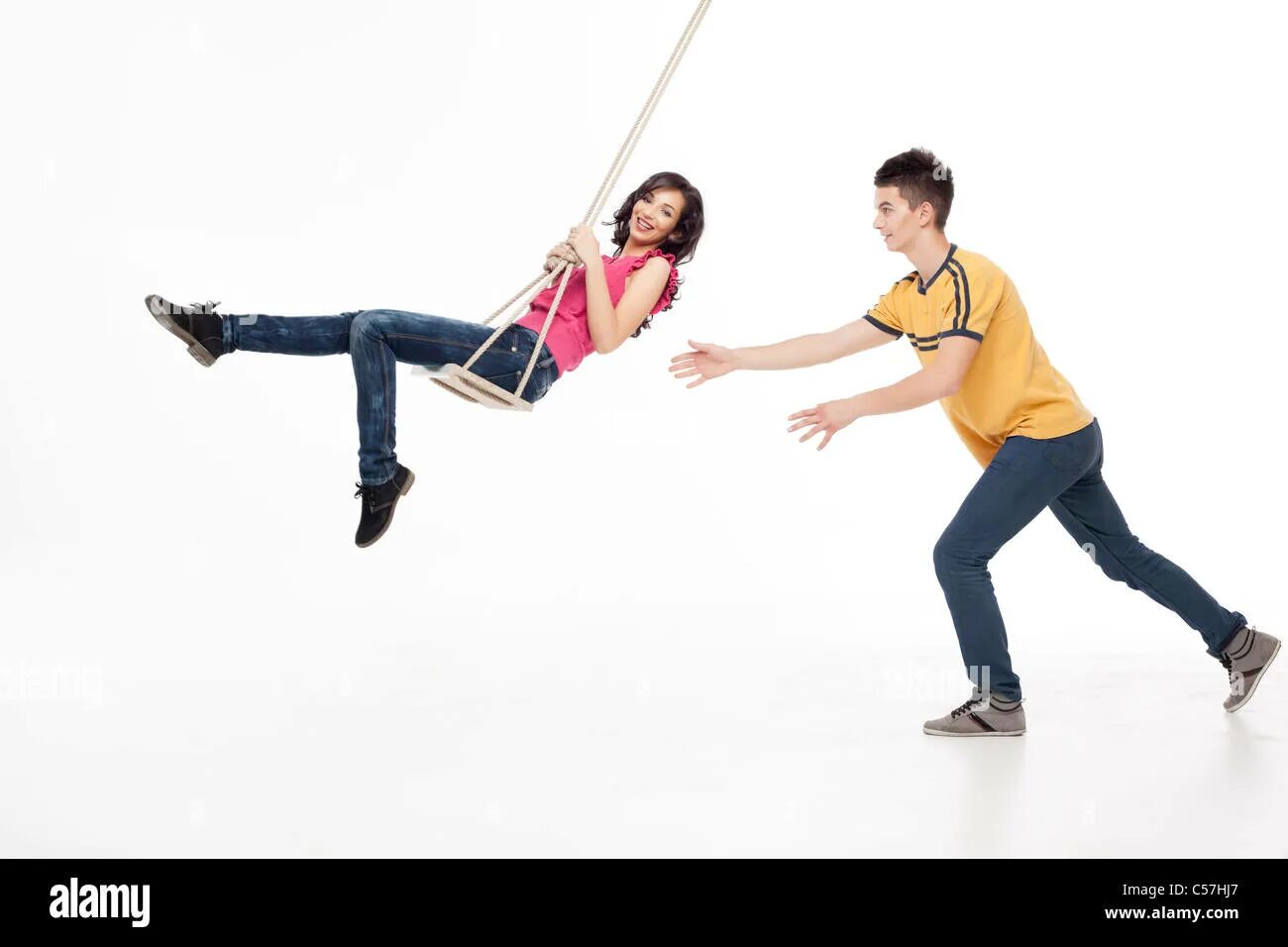 Lets swing. 2d people swing. male female on a swing. male vs female on a swing.