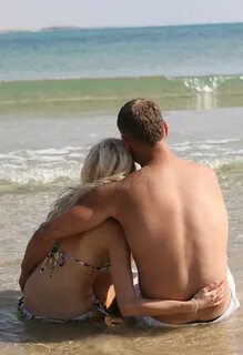Couple relaxing on the beach.