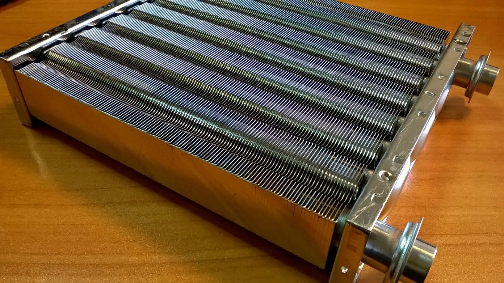 Вторичный теплообменник для газового котла навьен фото. Датчик перегрева теплообменника навьен. Теплообменник (30012859c). Теплообменник вторичный навьен 16. Замена теплообменника котла навьен.