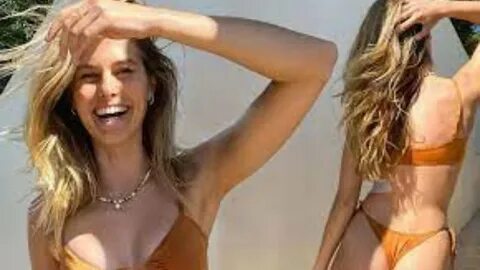 Natalie Roser leaves very little to the imagination in a TINY bikini with G-stri