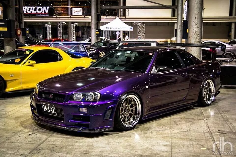 Skyline tuning. Nissan Skyline GTR r34 фиолетовый. Nissan Skyline GTR r34 Midnight Purple. Ниссан Скайлайн ГТР 34. Nissan Skyline GTR r34 Purple.