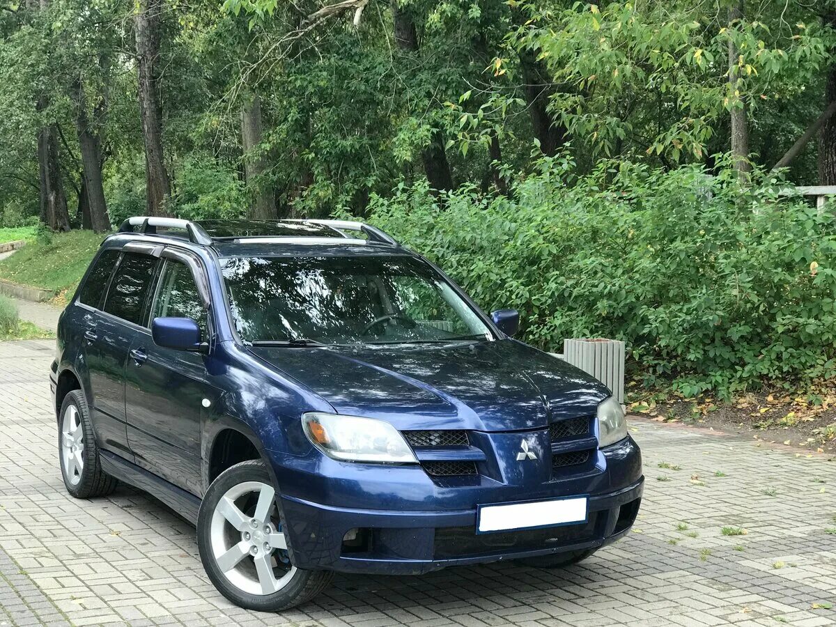 Mitsubishi outlander 2003. Митсубиси Аутлендер 1. Митсубиси Аутлендер 2003. Митсубиси Аутлендер 2003-2008. Митсубиши Аутлендер 2003.