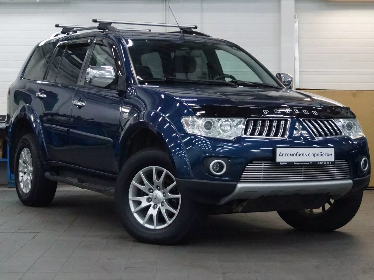 Pajero sport цена. Паджеро спорт 2 синий. Mitsubishi Pajero Sport внедорожник синий. Мицубиси Паджеро спорт 2,5 л 2010г. Mitsubishi Pajero Sport темно-синий.