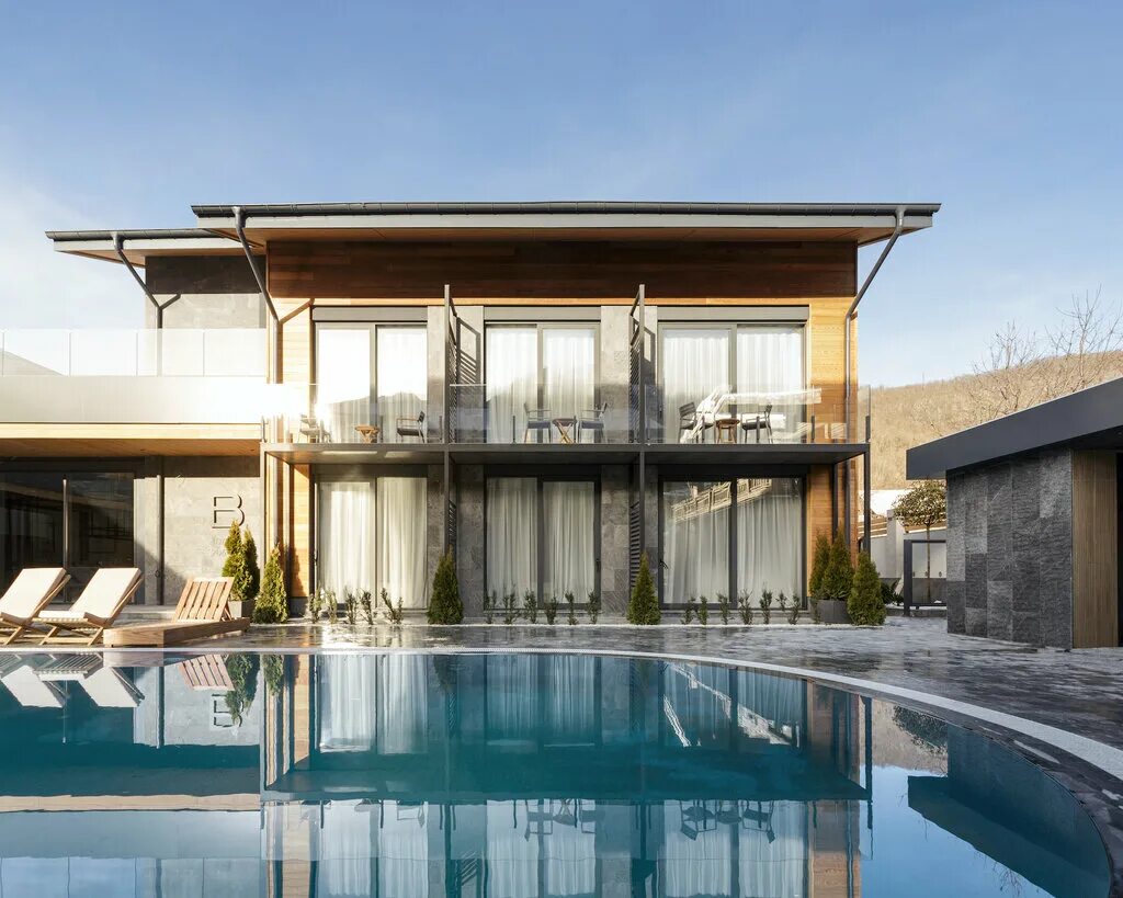 кирпичный дом с бассейном. ультима клаб сочи. ультима клаб отель спа. барная стойка рендер. Modern chalet architecture.