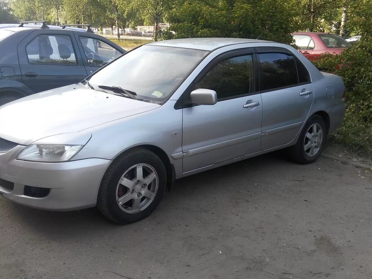 Mitsubishi lancer 2005 года. Митсубиси Лансер 2005. Лансер 2005 года. Мицубиси Лансер 2005 года серебристая.