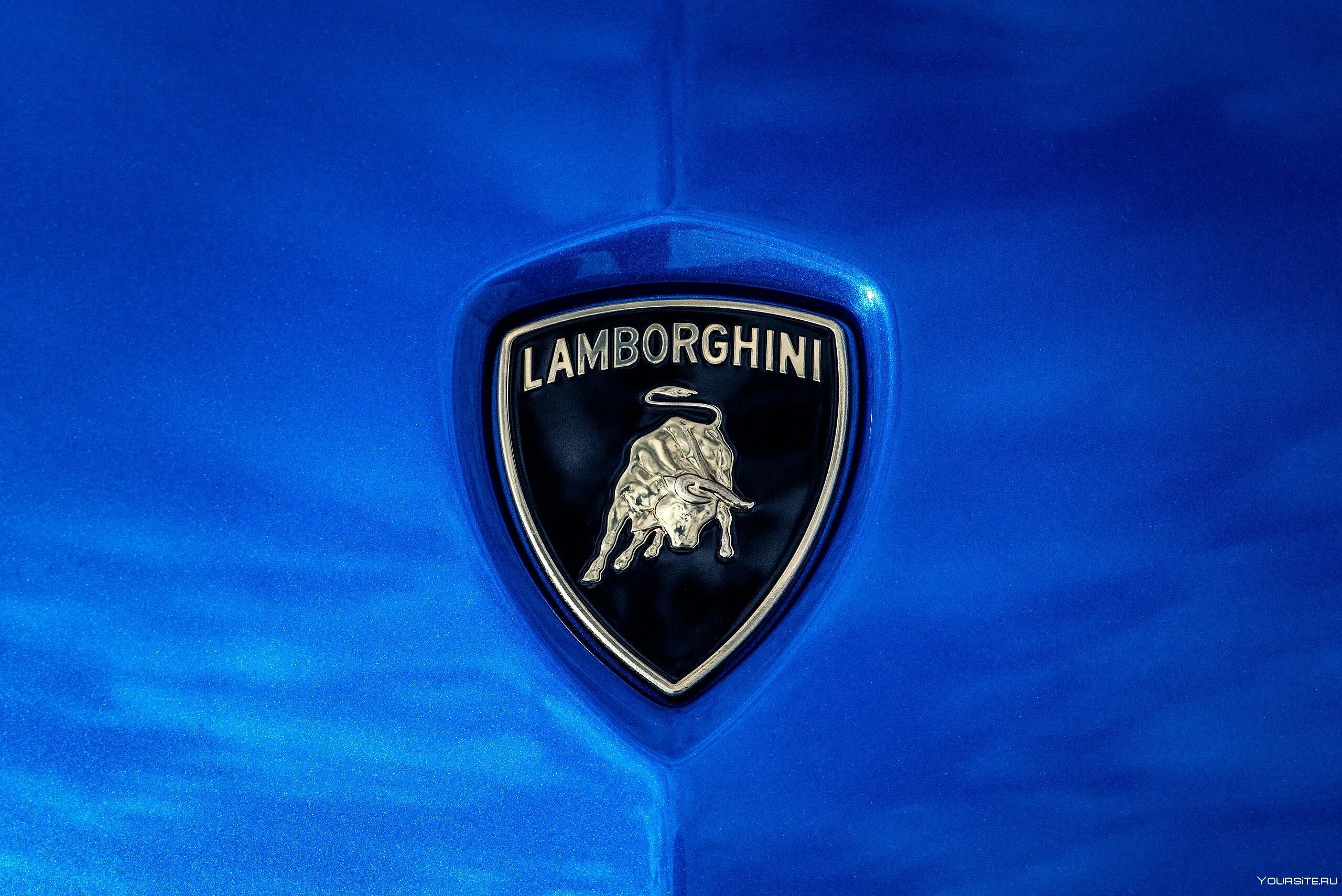 Новый значок ламборгини. Lamborghini логотип. Значки автомобилей Ламборгини. Ламборджини герб. Ламборгини значок машины.