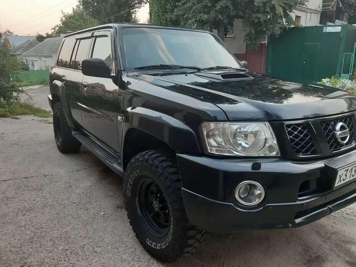 Купить кузов патрол. Patrol y61 Restyle. Nissan Patrol 2007 черный. Ниссан Патрол у61 Рестайлинг. Патрол y61 черный.