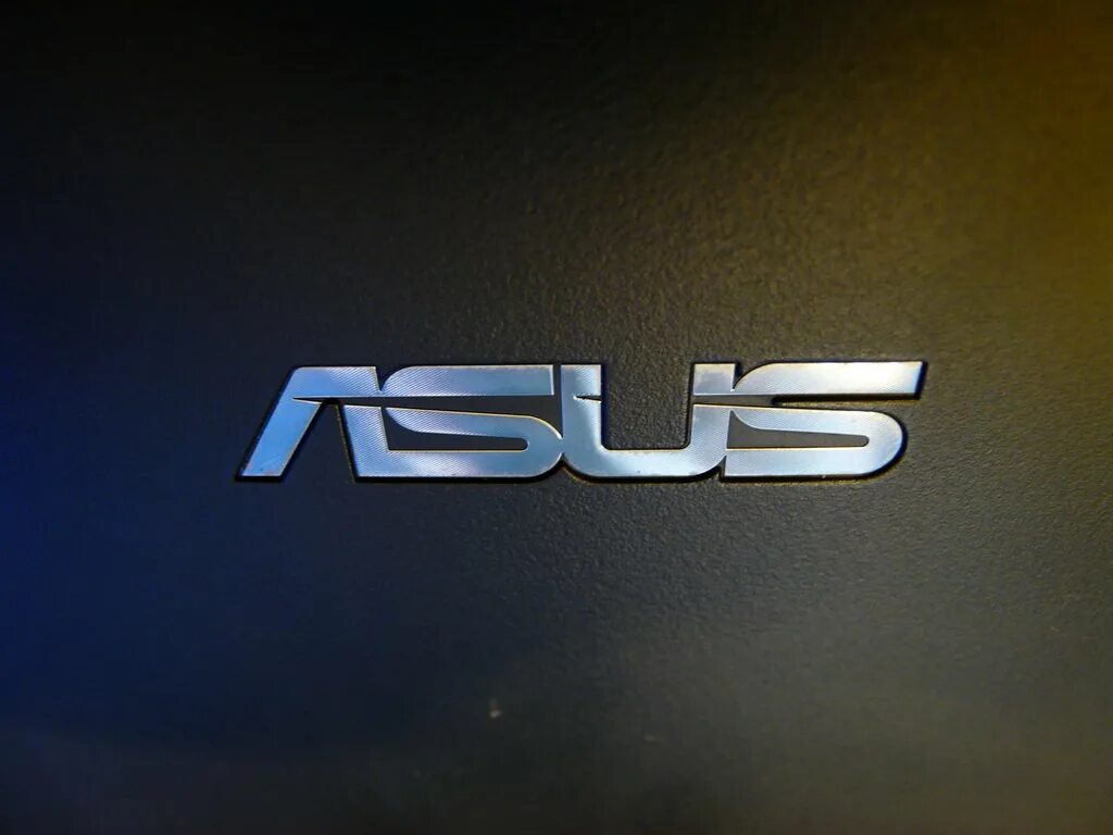 Асус чья. ASUS logo 2022. Ноутбук ASUS x52. Надпись асус. Круглый логотип ASUS.