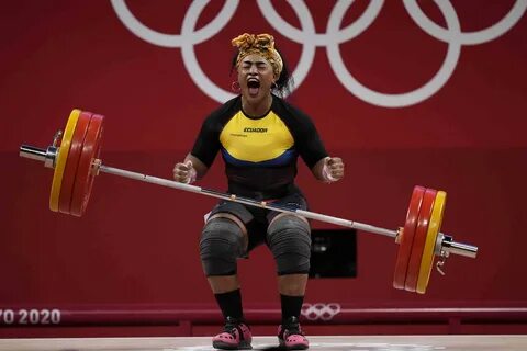 Tamara Yajaira Salazar Arce of Ecuador reacts after a successful lift, in t...