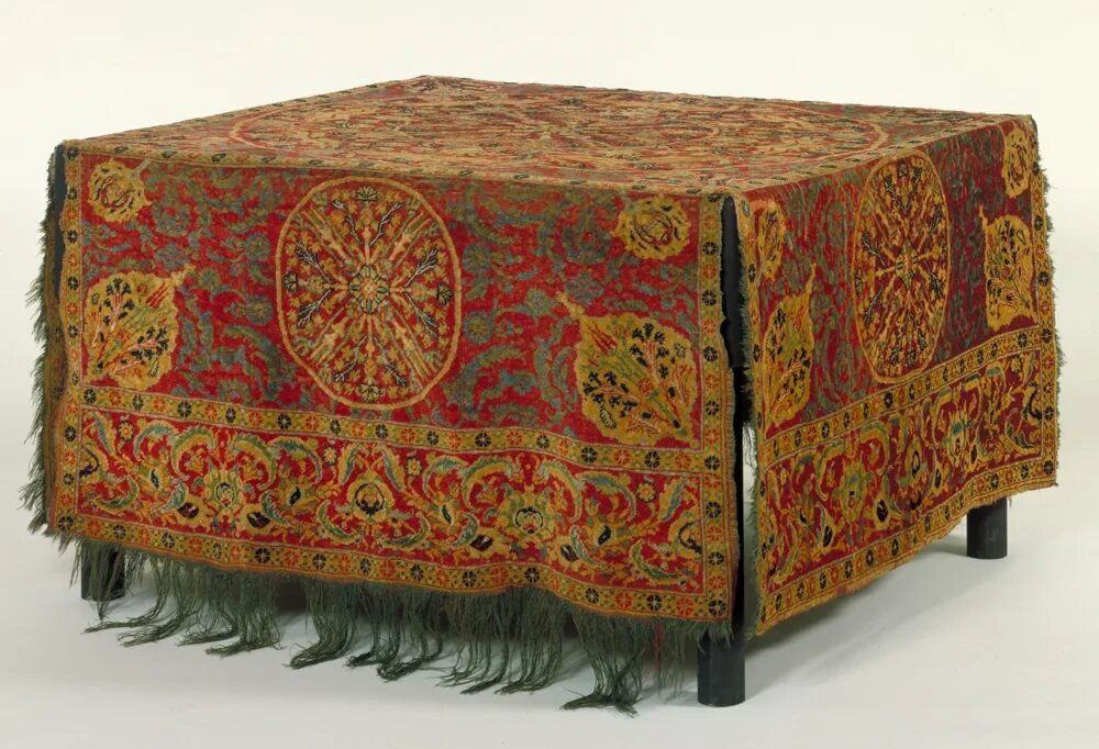The carpet is the table. The carpet is the table