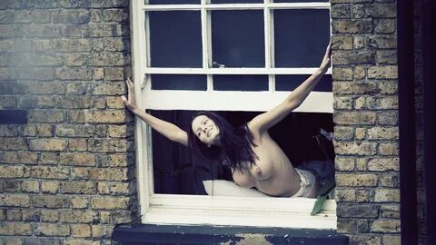 Naked in a window