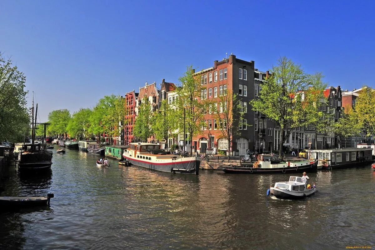 Нидерланды особенности страны. Амстердам, город в Нидерландах. Голландия Амстердам. Река Эй в Амстердаме. Фрисландия Нидерланды.