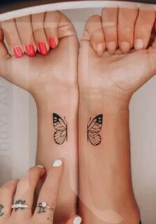 Matching butterfly tattoo on hand