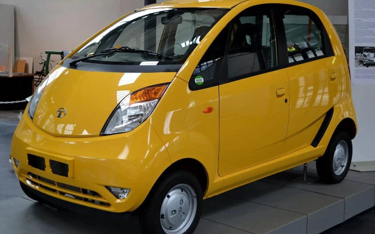 В каких городах дешевые машины. Автомобиль Tata Nano. Индийская машина Tata Nano. Tata Nano 2014. Tata Nano 2.