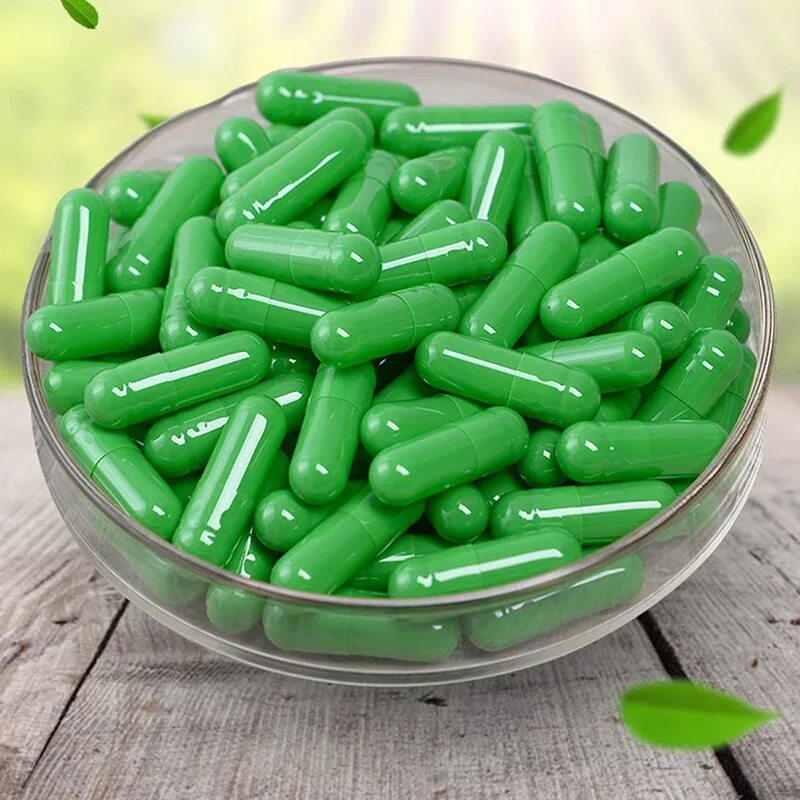 Почему таблетки в капсулах. Лекарство в желатиновых капсулах. Зеленые капсулы. Зеленые капсулы таблетки. Капсулы для медикаментов.