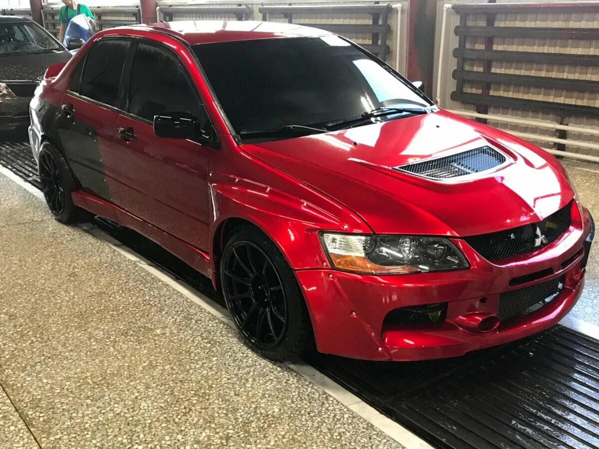 Мицубиси ростов дон. Mitsubishi EVO 9 красный. Mitsubishi Lancer Evolution 2006 красный. Mitsubishi Lancer EVO красный. Митсубиси Лансер 9 красный Эво.