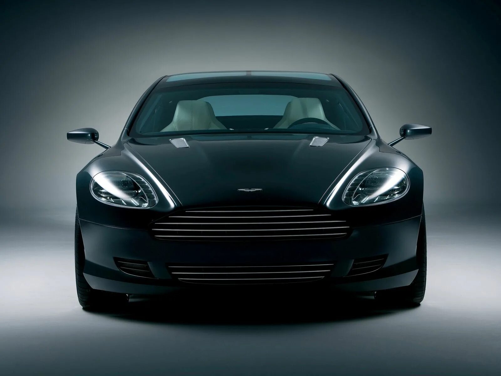 Черная машина перед. Aston Martin rapide Concept.