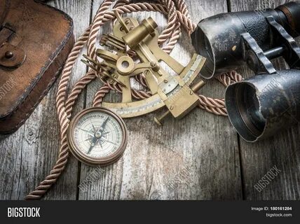 Download high-quality vintage still life compass,sextant spyglass images