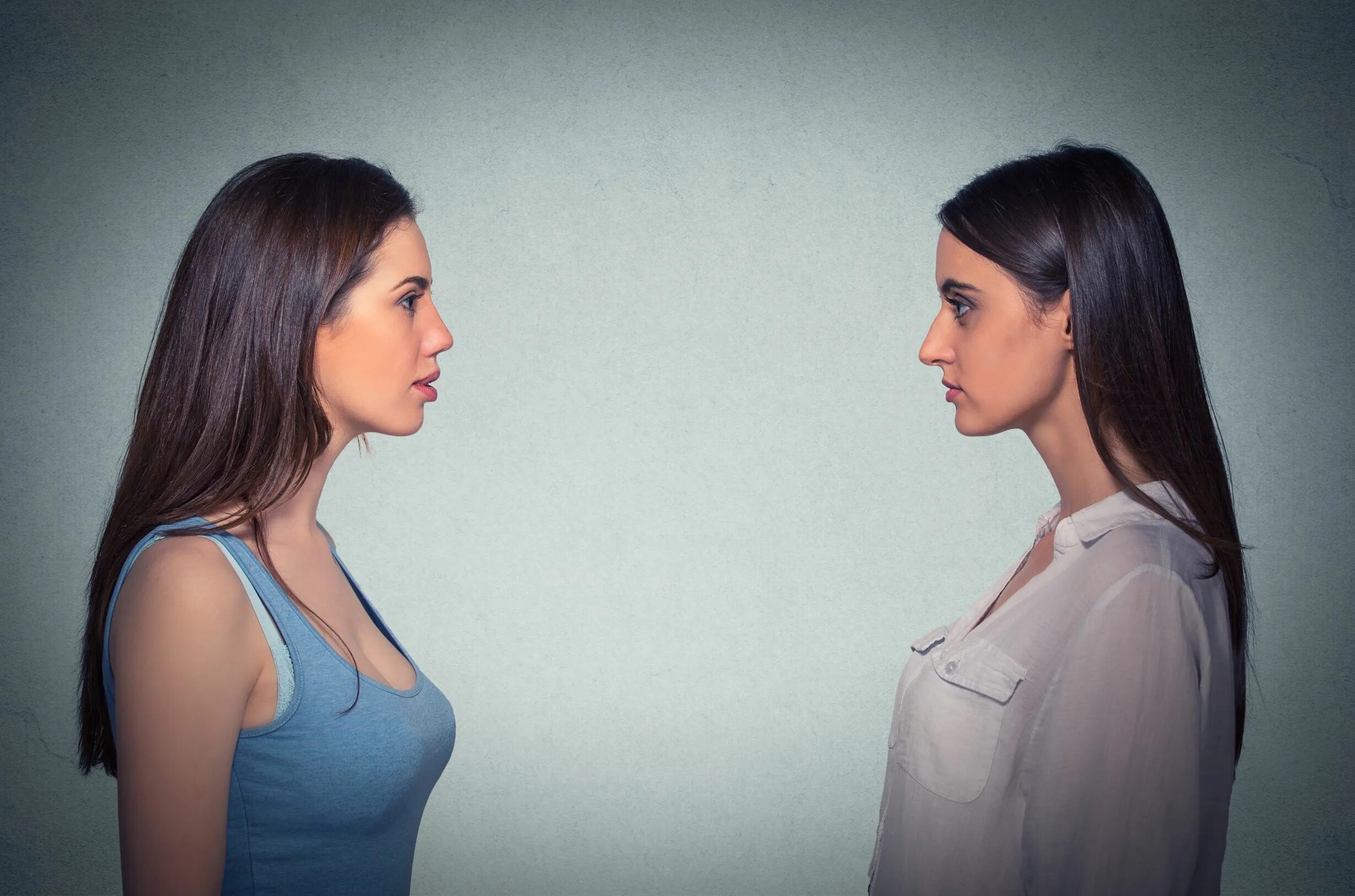 Looking at each other. Женщина смотрит документы. Mina Side profile. Hired young women to each other. Young woman profile.
