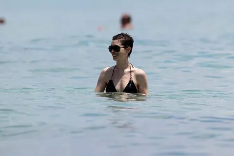 Anne Hathaway in Black Bikini on the Beach in Miami. 