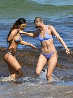 SI Swimsuit Model Danielle Herrington Oils Herself Down on a Hot