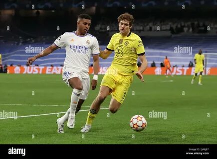 Marcos Alonso of Chelsea FC battles for possession with Erik Lamela of Tott...