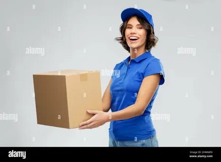 Download this stock image: happy delivery girl with parcel box in blue - 2H...