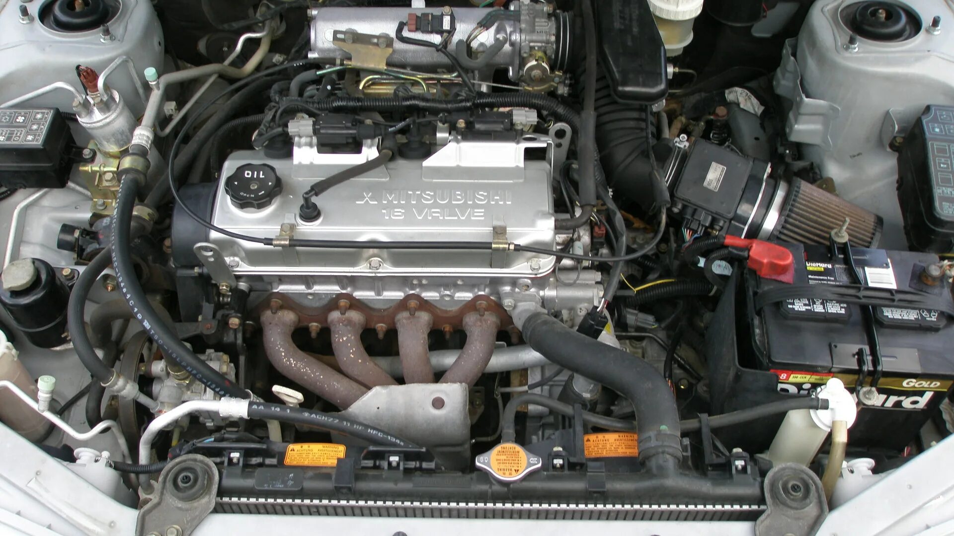 1.3 литра двигатель. Мотор Мицубиси Мираж 2001. Mitsubishi Mirage 2001 двигатель. Мотор 4g15 Mitsubishi. Мотор Митсубиси Мираж 1.5.