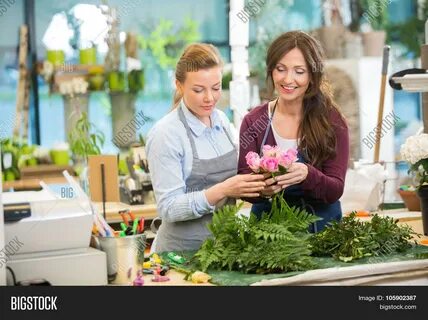 Download high-quality Florists making bouquet pink roses flower shop images