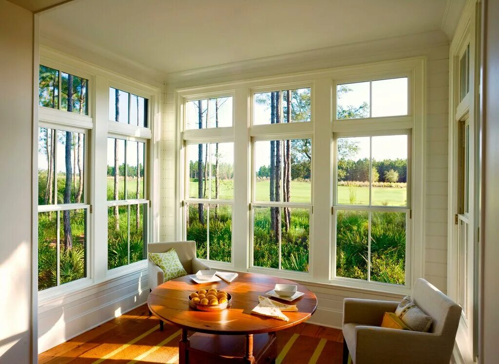 There is a big window. Sunroom. sun-porch. interior big window.
