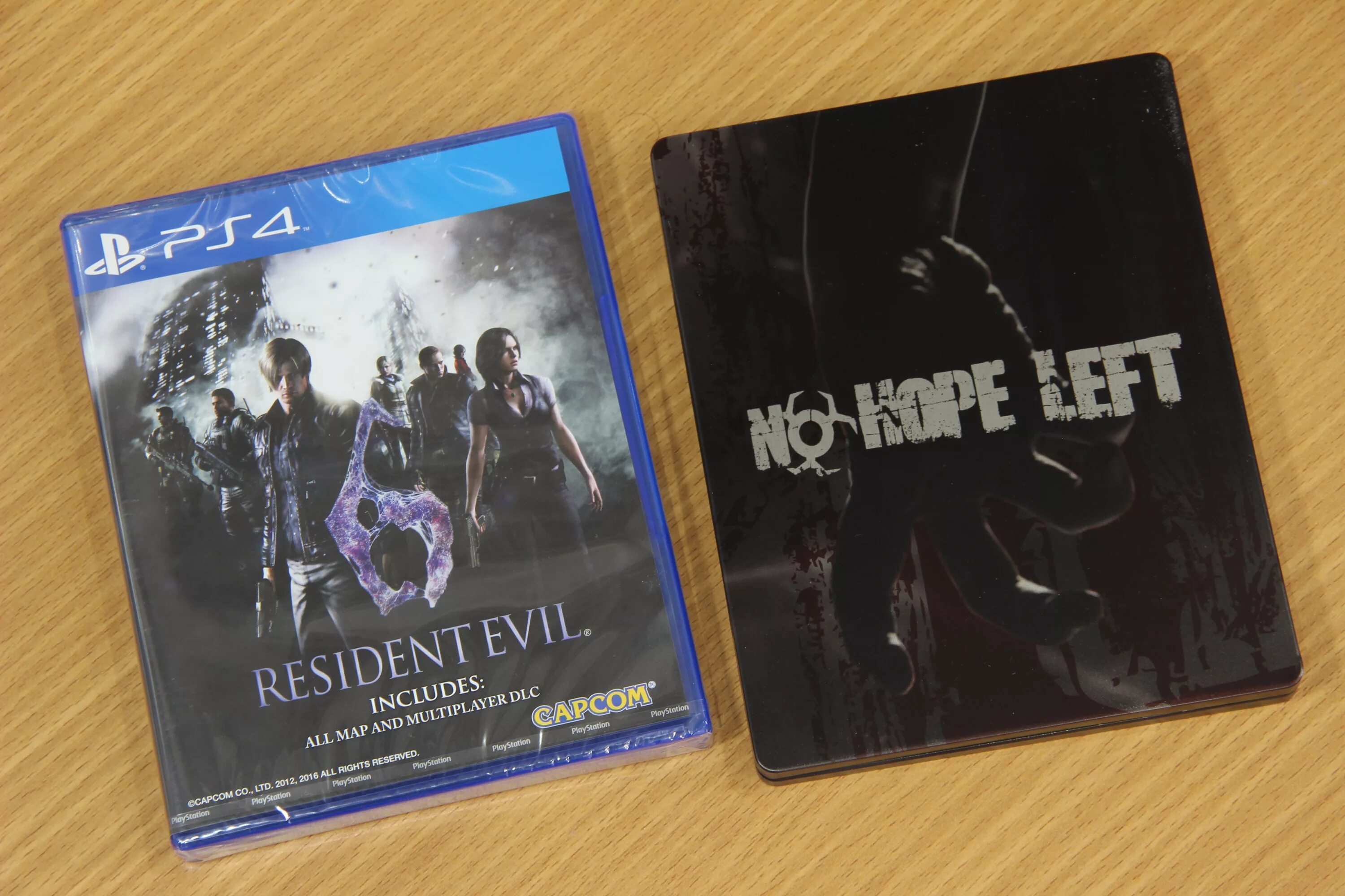 Резидент 4 пс5. Resident Evil 4 на PLAYSTATION 2 коллекционное издание. Resident Evil Village Steelbook Edition. Resident Evil Village стилбук.