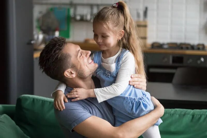 His loving daughter. Папа жалеет дочку. Девочка на руках у папі. Папа с дочкой на руках. Папа держит дочь на руках.