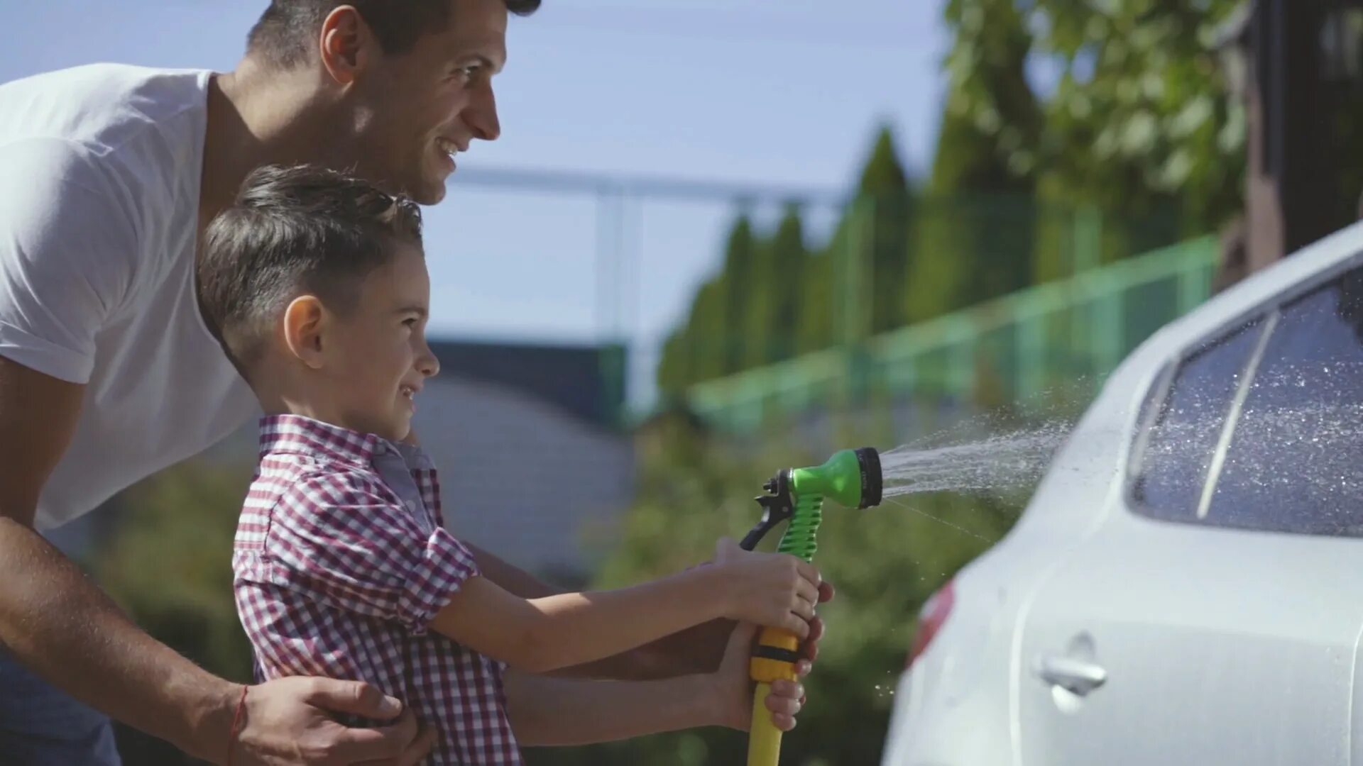 The car is slow. Father boy car. Grandfather washing car. Boy car Wash. Son helps his father to Wash a car Front Window.