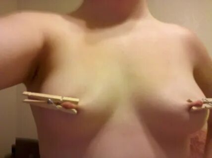 amateur self portrait of clothespins and nipples - breast torture