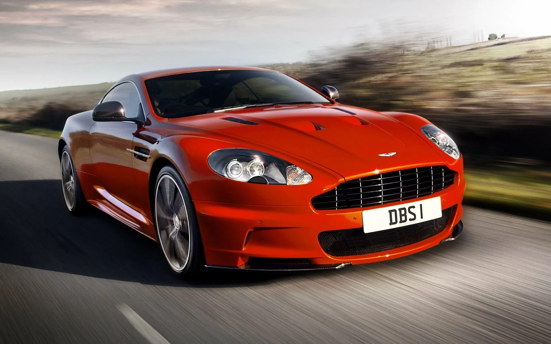 Aston Martin DBS v12 красный. Красный спорткар Aston Martin DBS v12.. Астон Мартин ДБС. Астон Мартин ДБС В 12.