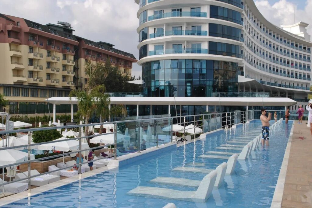 Q premium. Ку премиум Резорт Алания. Q Premium Resort 5. Интурист Турция отель. Интурист Алания отель.