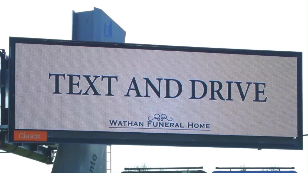Text and john. Text and drive. drive billboard. funeral home billboard. it hard text and drive.
