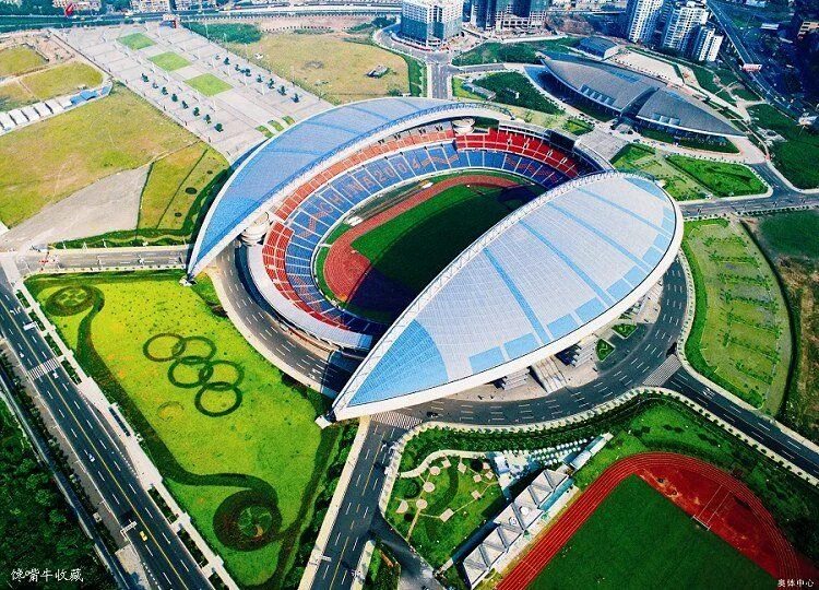 Стадионы китая. Тяньцзинь Олимпийский стадион. Тяньцзинь Олимпик центр Стэдиум. Чэнду стадион. Стадион в Чунцине.