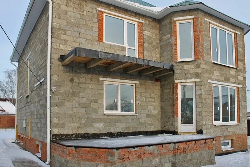 Дома из арболитовых блоков. Фибролит арболит. Дом из арболитовых блоков. Арболит отделка. Арболит облицованный кирпичом.