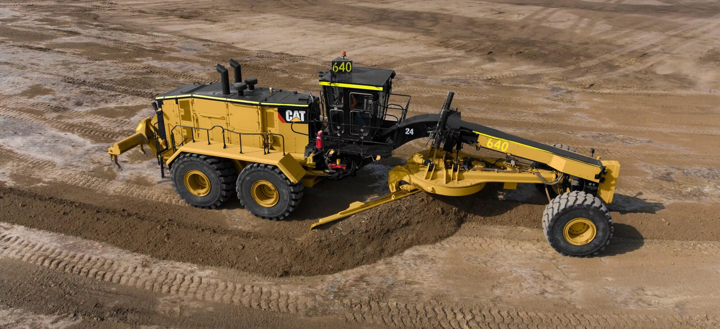 Работа автогрейдер вакансии. Автогрейдер Cat 24. Автогрейдер Caterpillar 24м. Caterpillar 120m автогрейдер. Самый большой грейдер Катерпиллер.