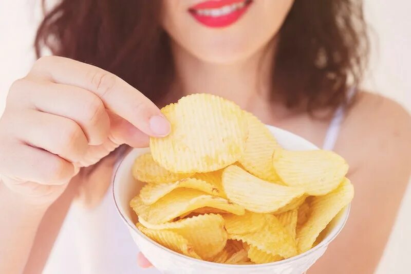 Eating potato chips. Eating potato chips. Eating crisps with friends for kids. Eating potato chips. Eating potato chips.