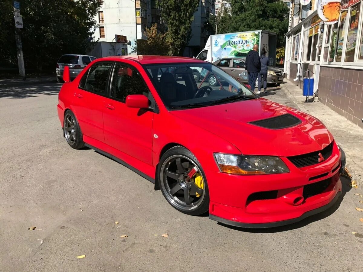 Мицубиси эвик 9. Oz EVO-16 Mitsubishi Lancer. Lancer Evolution 9. Красный ланцер Эволюшен.