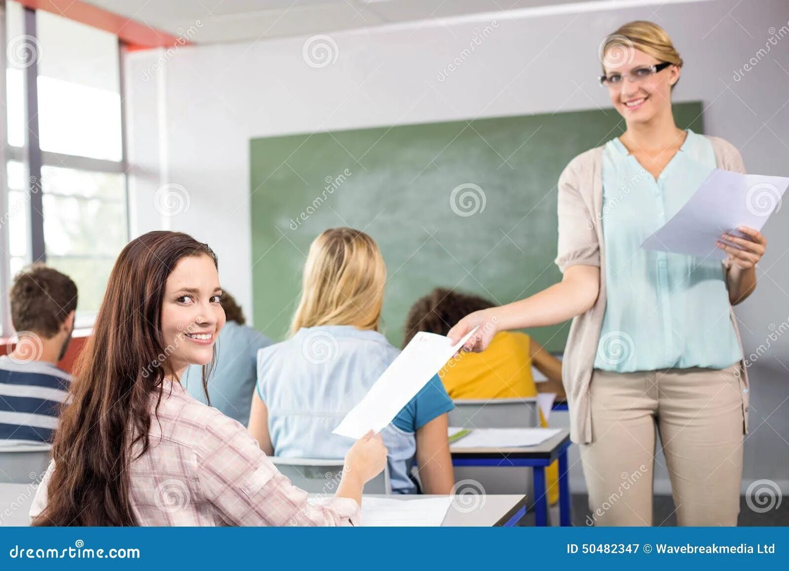 Hand teach. Hand in to a teacher. teacher and pupil hand. teacher student hand. teacher hand on hand of pupil.