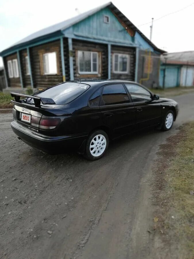 Toyota Carina 1997 е чёрный. Toyota Carina черная. Toyota Carina e черная. Toyota Carina e 1993 года лифтбек. Тойота черный дым