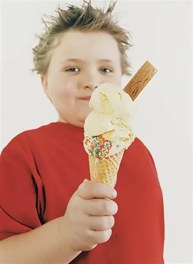 A treats children. A boy holding a Chocolate.