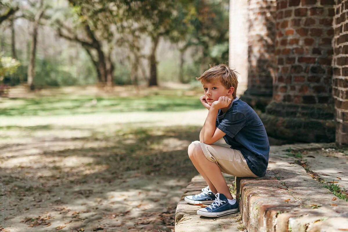 Little boy child. At the Park boy. Outdoor boys. Bored boy.