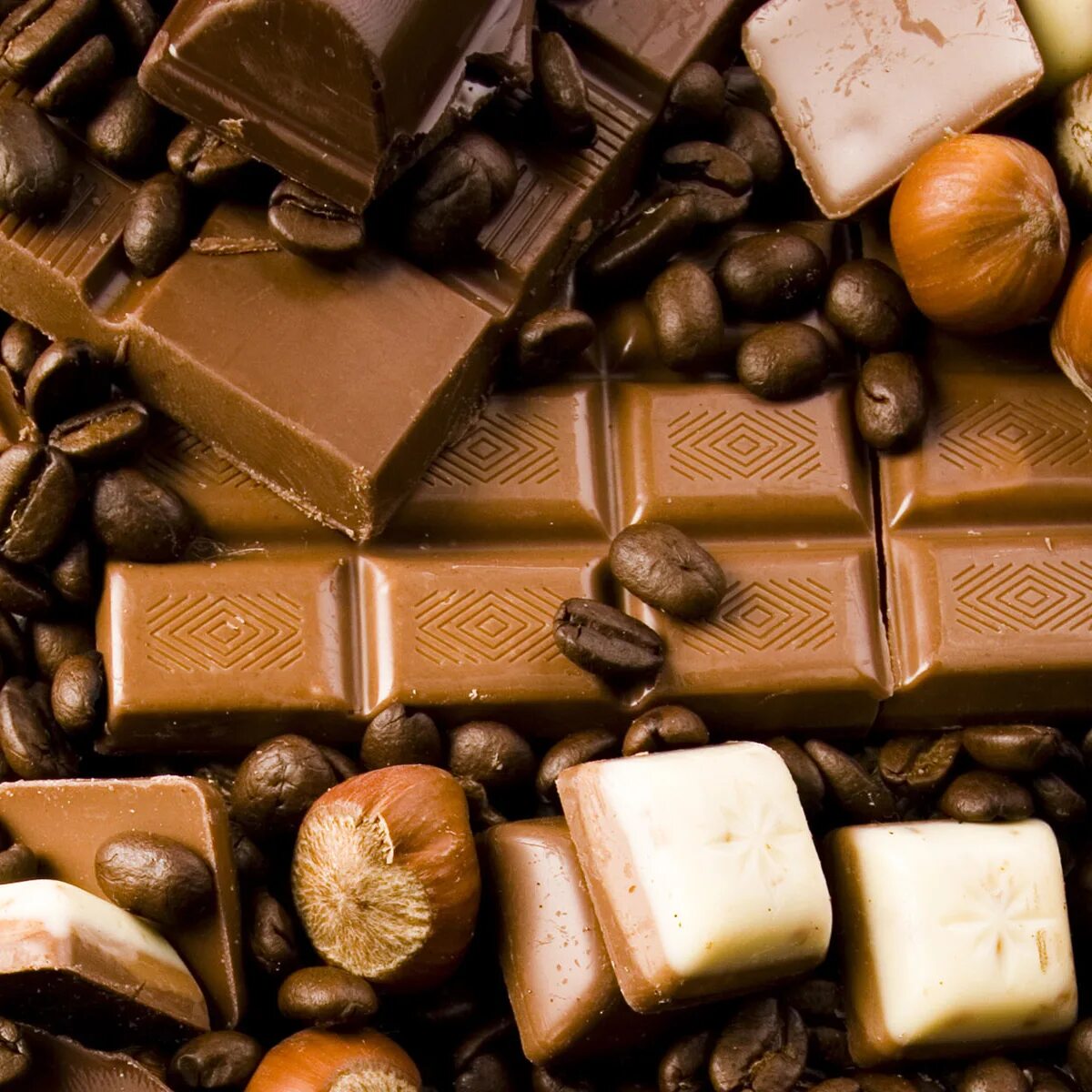 Шоколад с орехами. Шоколад обои. Кофейные конфеты шоколадные. Шоколад фон. День шоколада купить